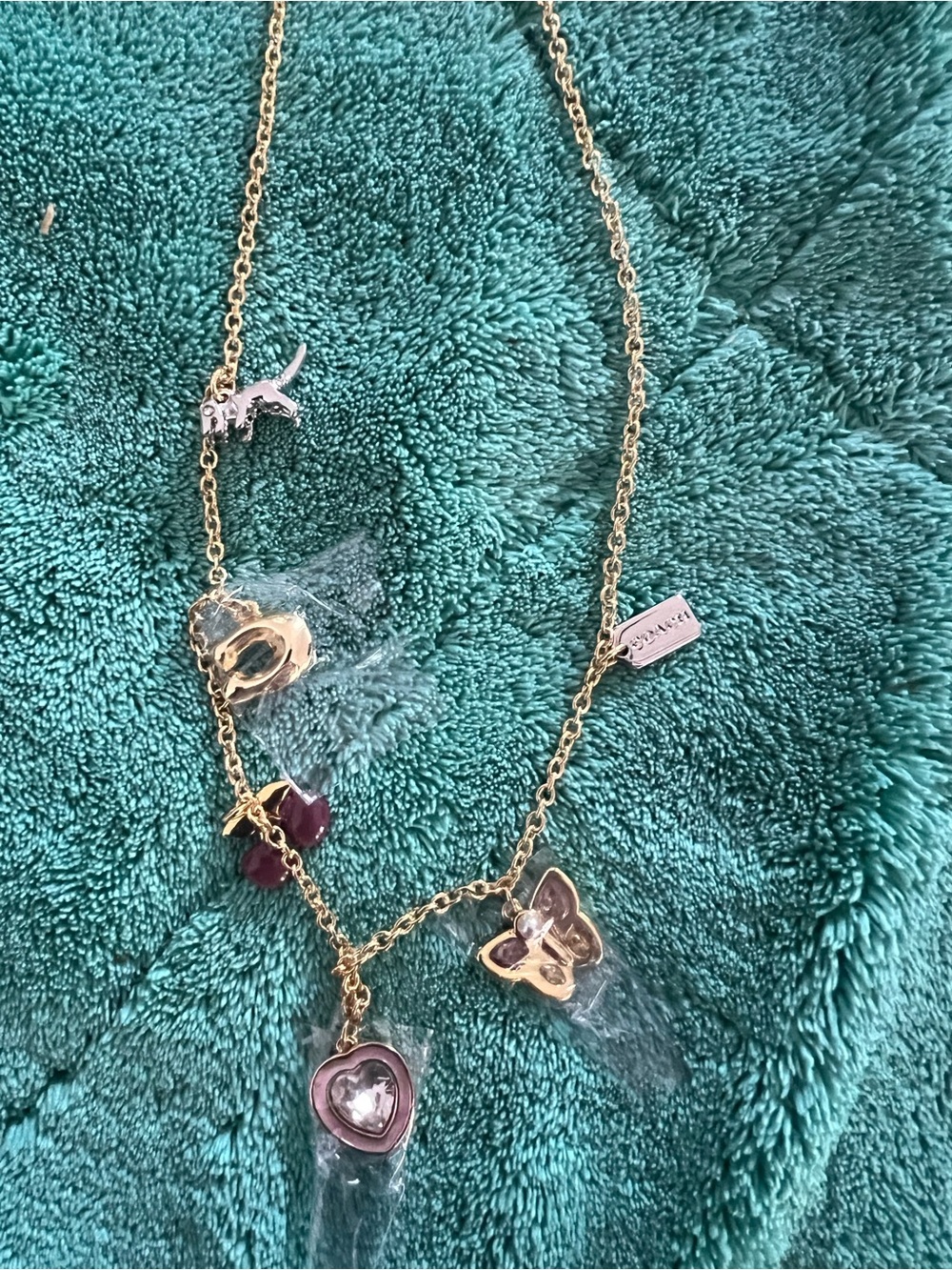 Coach Gold-Tone Multi-Charm Necklace.